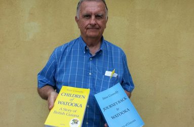 Mr. Steve Connolly holding the two books; Children of Watooka and Journey Back to Watooka