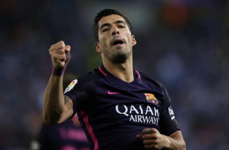 Barcelona's Luis Suarez celebrates a goal. REUTERS/Albert Gea