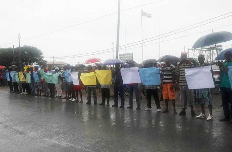 Sugar workers protesting braved the weather during the protest