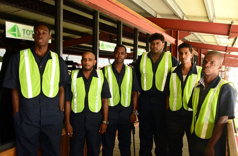 Six of the seven ex-sugar workers who are part of the oil and gas training programme at TotalTec Academy (Adrian Narine photos)