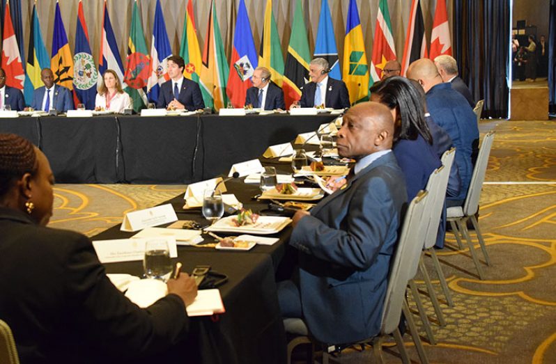 Foreign Affairs Minister Carl Greenidge and other officials at the Eight Summit of the Americas (Rabindra Rooplall photo)