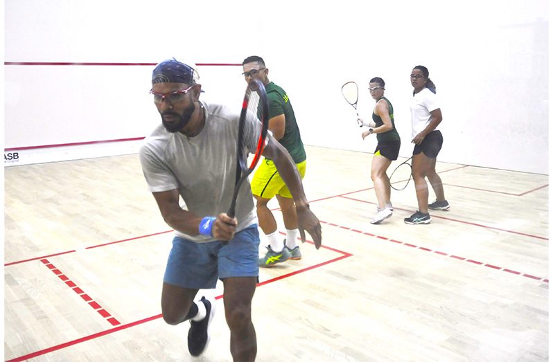 Sunny Seth plays off the glass as he and Kaylee Lowe beat the senior National pair of Mary Fung-A-Fat and Alex Arjoon at the NRC (Sean Devers photos)