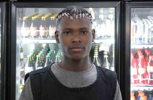 Shane Charles, 19, a staff member of Andrew's Supermarket