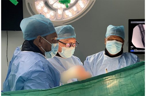 Dr. Wang Fei (middle), Dr. Elliot (right), and Dr. David Murillo (left) during surgery