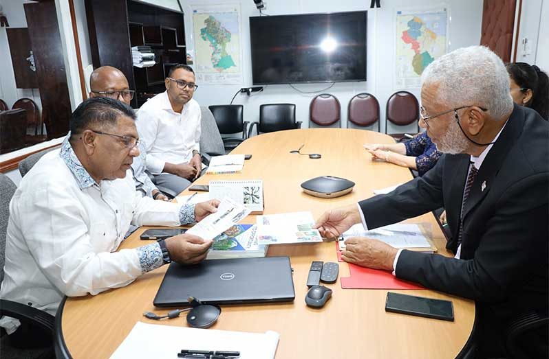 Agriculture Minister, Zulfikar Mustapha, interacts with Suriname’s First Gentleman, H.E. Glenn Geerlings, with information that can foster closer co-operation between the two countries in advancing their agriculture sectors