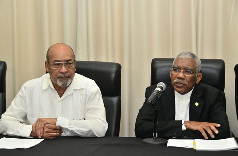 Presidents David Granger and Desiré Delano Bouterse addressing journalists at the Guyana Marriott on Friday