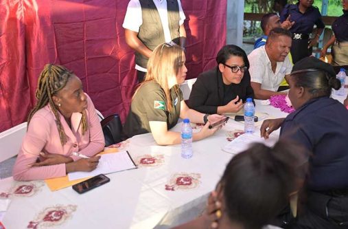 Minister within the Ministry of Housing and Water, Susan Rodrigues listens keenly to the concerns of one of the many residents during the meeting with residents of Central Mahaicony