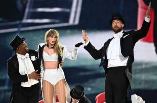 Taylor Swift is joined on stage by Travis Kelce, right, during The Eras Tour at Wembley Stadium on June 23 in London. Gareth Cattermole/TAS24/Getty Images
