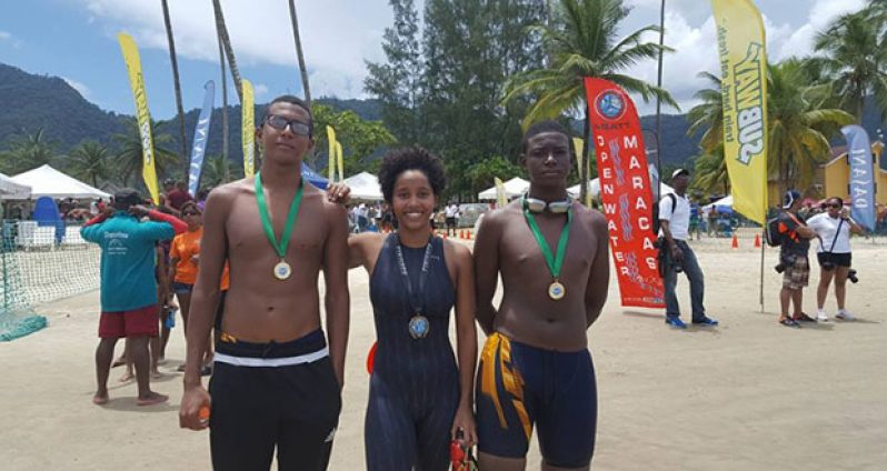 L-R Alex Winter, Soroya Simmons,and Daniel Scott,along with the medals they won.