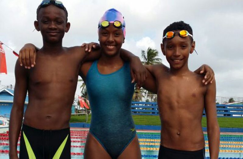 CARIFTA Swimming Championship qualifiers, from left: Leon Seaton, Lian Winter and Raekwon Noel at the pool last Sunday.