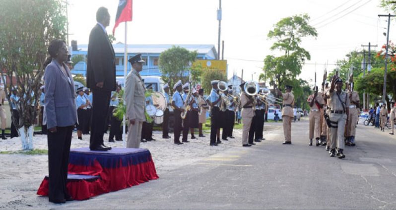 Public Security Minister Ramjattan takes the salute from parade commander, Assistant Commissioner Clifton Hicken