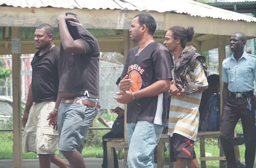 The men after they appeared in court on Monday.