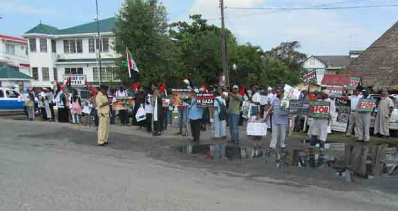 Protesters gathered yesterday morning with their placards