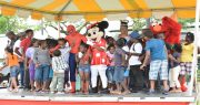 Children from youth groups interact with the cartoon characters