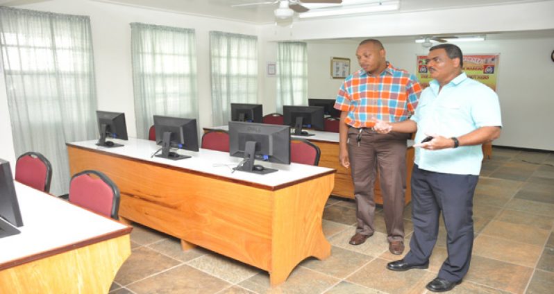 Assistant Commissioner Operations David Ramnarine examining the Zara Computer Laboratory at the training college last Saturday
