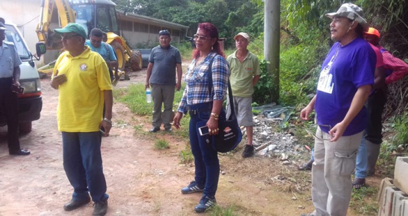 Vice President Allicock and his Advisor, Mervyn Williams, in discussion with persons at the construction site of the new Port Kaituma Hospital