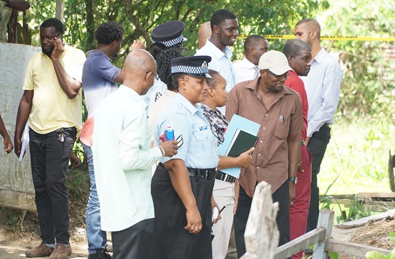 Police detectives at the scene where the murder took place