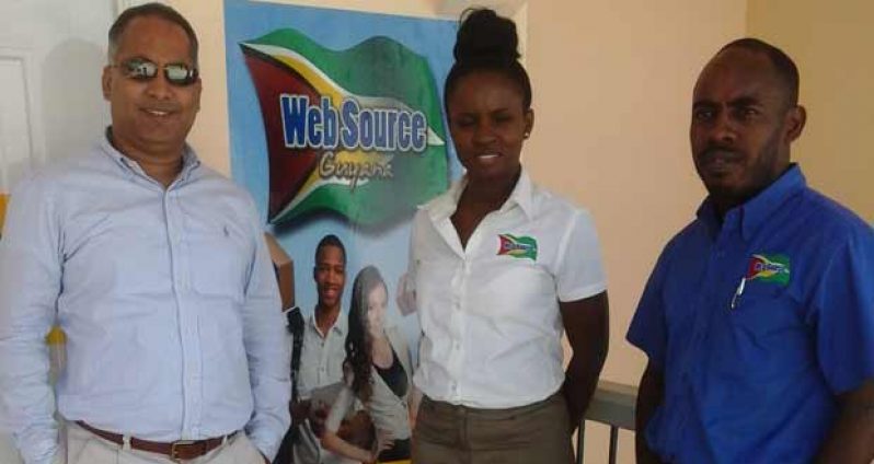 Maharaj and two of the staff members from the Websource Guyana Office striking a pose