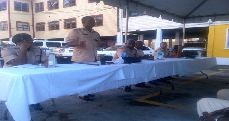 Commander Hicken (standing) and his senior officers at the head table during Monday’s meeting with stakeholders at ‘A’ Division Headquarters, Brickdam