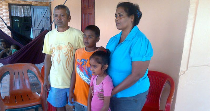 The dead couple’s children with the woman’s parents.