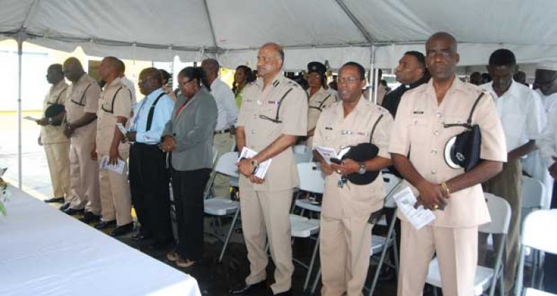From right are Traffic Chief Denhert, Commander Hicken, Commissioner Seelall Persaud, PS Johnson, a religious member, Traffic Officer Brutus, Deputy Commander Moore, and
Force Training Officer Williams