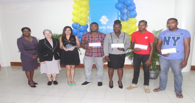 Winners of the “Deal on Wheels” promotion with Republic Bank officials