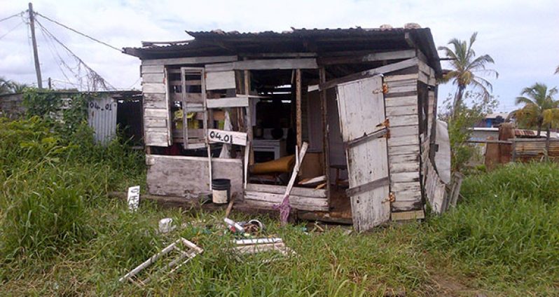 The suspect’s home  which angry residents thrashed on Monday