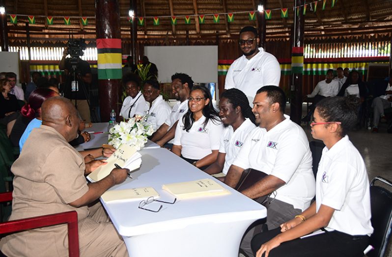 TCI Members submit their party’s List of Candidates to GECOM CEO, Keith Lowenfield (left) inside the Umana Yana on Friday