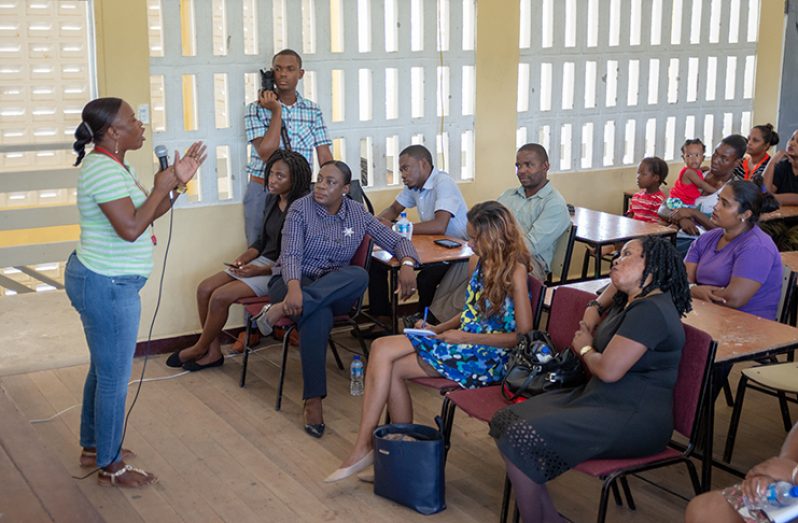 The headteacher at Hope Secondary speaks to the minister about the challenges facing teachers (Delano Williams photo)