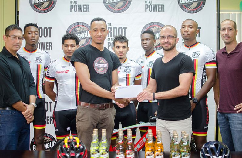Brand Coordinator, Sean Abel, hands over sponsorship to Team Evolution’s president, Keith Fernandes. Also in photo is  vice president, Stephen Fernandes (first from right),and Secretary, Andrew Arjoon (first from left),along with the other team members.
