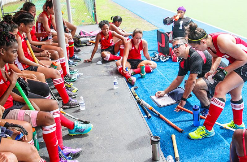 Guyana’s Coach, Phillip Fernandes, working on strategy during their clash with Puerto Rico