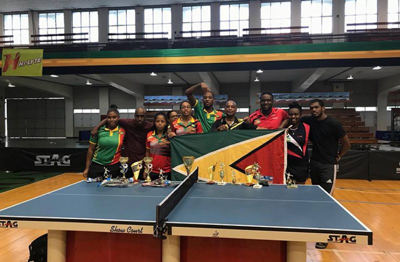 Team Guyana poses with their medals and trophy haul at the conclusion of the 60th CRTTF Senior Championships in Jamaica.