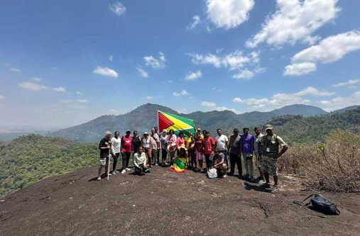 Operators of Touring Guyana and a group of patrons on Kanuku Mountains in Region Nine