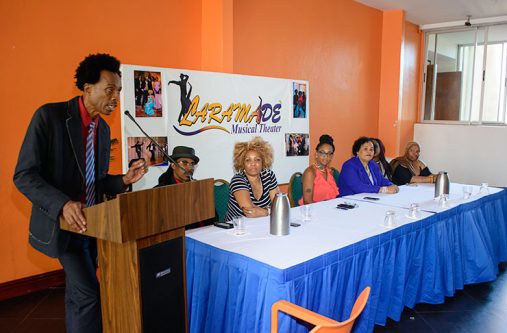 Producer and writer, Launce Northe speaking of the upcoming production, ‘Joie de Vivre’.  Seated at the head table are other members of the company