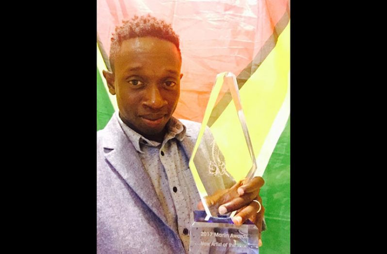 Medas showing off his award to his Facebook Family just after getting off-stage Saturday