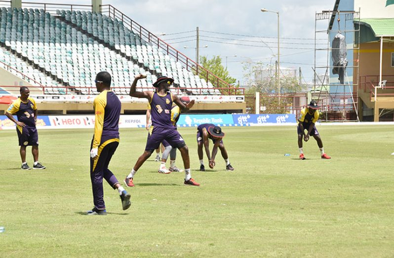 The Trinbago Knight Riders go through some of their paces at yesterday’s net session. (Photos: Adrian Narine)