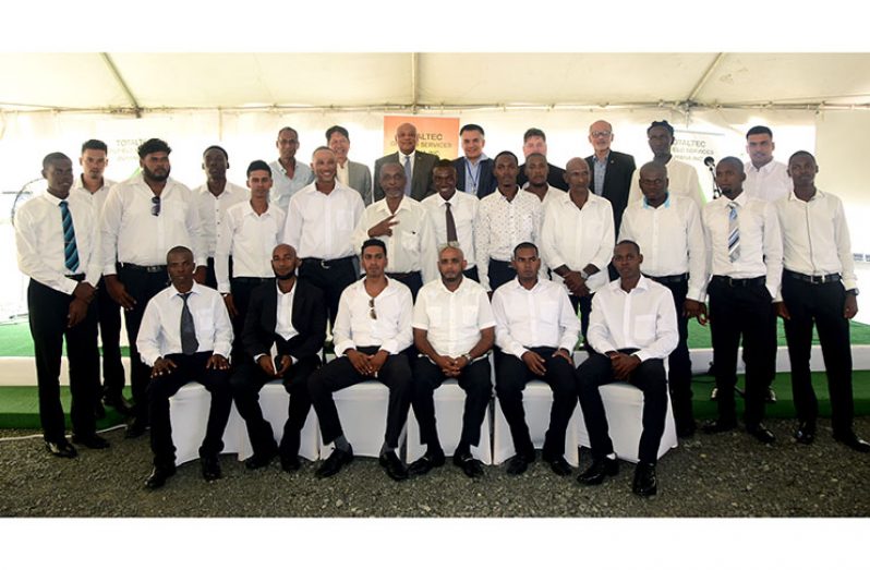 The 22 ‘Oilfield Safety’ graduates with Minister of Natural Resources, Raphael Trotman (standing centre back row) and representatives of Totaltec and other international oil firms