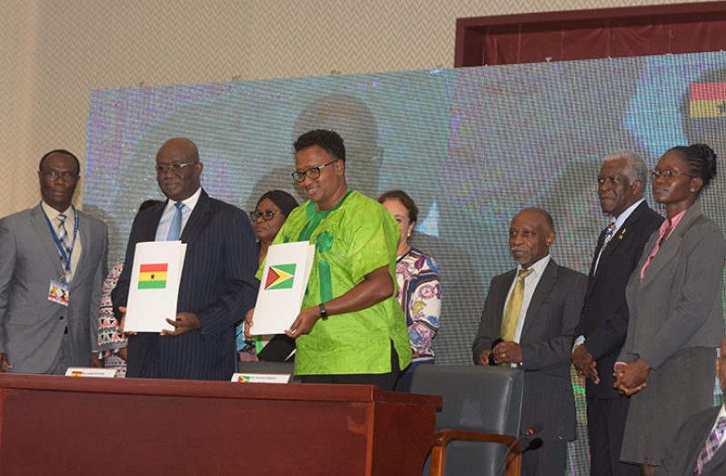 Minister within the Ministry of Public Infrastructure with responsibility for Aviation, Annette Ferguson, seals the deal with the Memorandum of Understanding (MoU) for bilateral air-service collaboration with Ghana’s Minister of Aviation Joseph Kofi Adda on Friday.
They are each flanked by representatives of their countries, including Minister of Foreign Affairs Carl Greenidge (third right) and Director-General of the Guyana Civil Aviation Authority (GCAA) Egbert Field (second right) (Samuel Maughn photo)