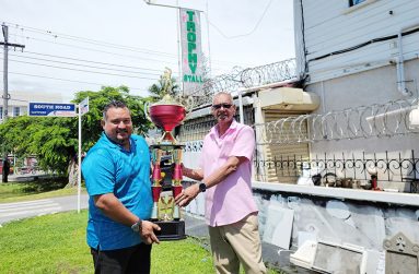 John Ramsingh of FL Sport (left) with one of the trophies to be awarded at the end of the tournament, along with Ramesh Sunich of Trophy Stall