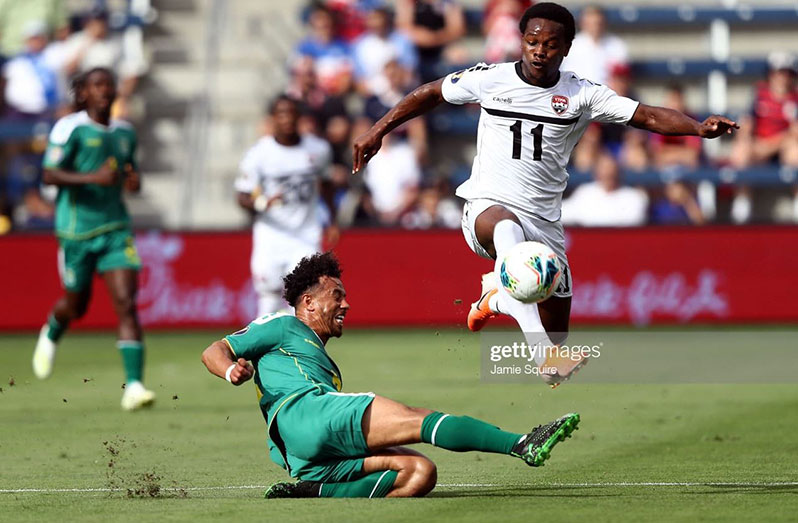 FLASHBACK! Levi Garcia of Trinidad and Tobago controls the ball as Samuel Cox of Guyana attempts to slide tackle during the first half of the CONCACAF Gold Cup match at Children's Mercy Park on June 26, 2019 in Kansas City, Kansas. (Photo by Jamie Squire/Getty Images)