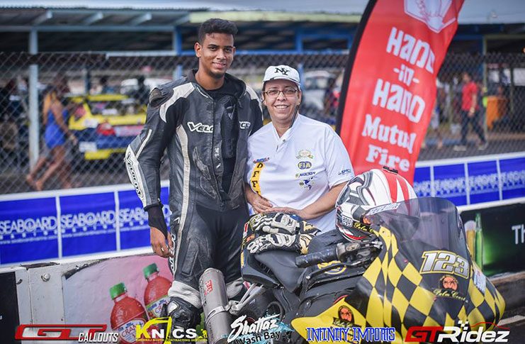 Raverio Tucker stands with his bike and a GMRSC Marshal