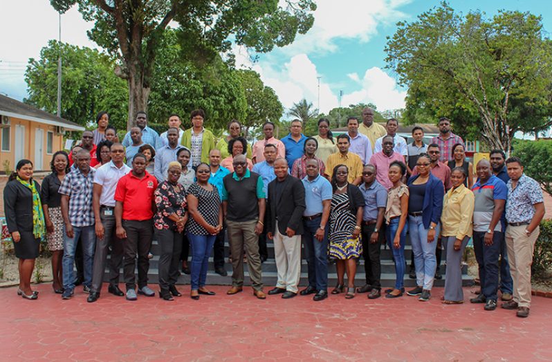 Chief Education Officer Marcel Hutson and Assistant Chief Education Officer (ACEO)-Technical, Patrick Chinedu Onwuzirike (front row, centre) pose with all the participants of the retreat