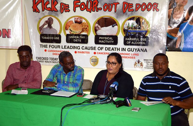 From left, Petra’s Mark Alleyne and Deputy Permanent Secretary of MoPH, Glendon Fogenay, look on as Dr Kavita Singh of the Chronic Diseases department makes a point. At the extreme right is Petra’s Troy Mendonca. (Adrian Narine photo)