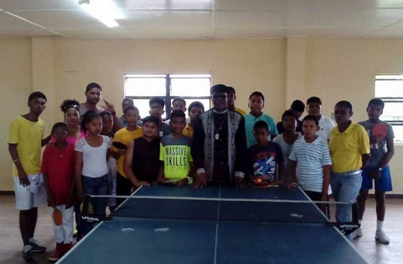 NSC Administrator Gervy Harry (centre) with the players at the Bartica Community Centre
