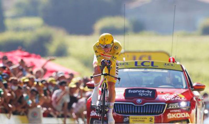 UAE Team Emirates rider Tadej Pogacar of Slovenia wears the yellow jersey in action during stage 20. (REUTERS/Stephane Mah)