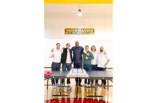 NBA legend Hakeem Olajuwon stands with members of the Coastal Rim Properties leadership team after confirming his investment and home purchase at the TAJ DIAMOND master-planned community in Guyana