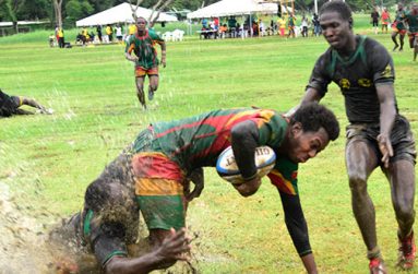 A Guyanese player is taken down brutally during the Green Machine’s game against Jamaica in the National Park last month.