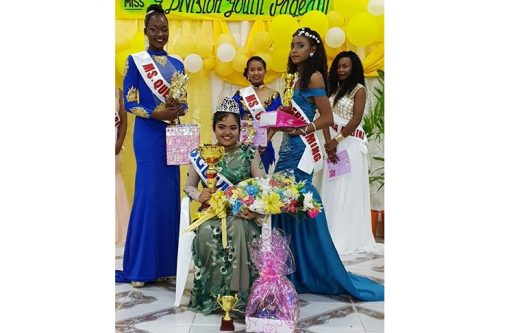 The winner flanked by other participants