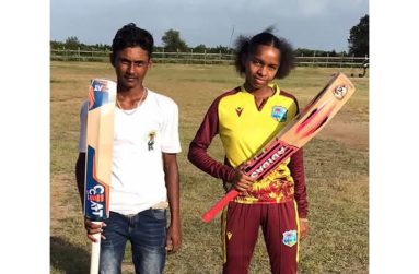 Tamesh Deonandan and Danellie Manns pose with their bats