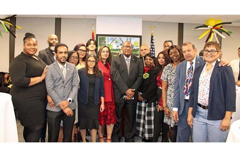 Consul General of Guyana to New York Ambassador Michael E. Brotherson, centre, surrounded by his dedicated staff at the 54th Republic Day observance at the Guyana Consulate in Manhattan (Tangerine Clarke photo)